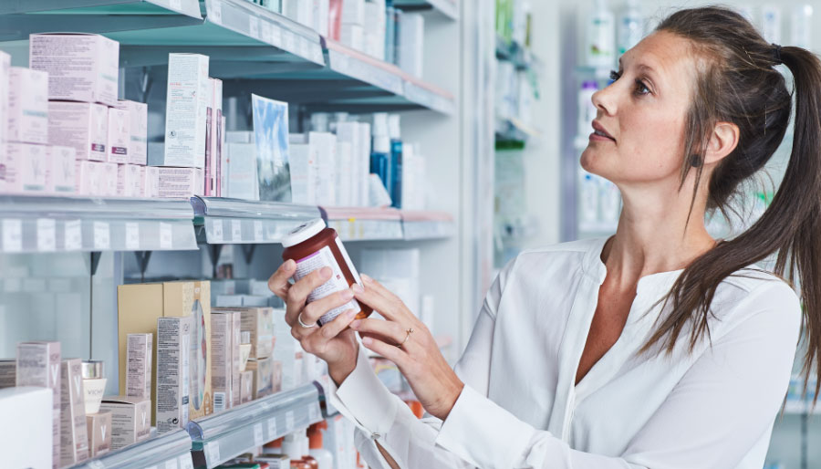 Woman looking for a probiotic product